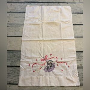 Vintage hand-embroidered cat kitten in an umbrella pillowcase.